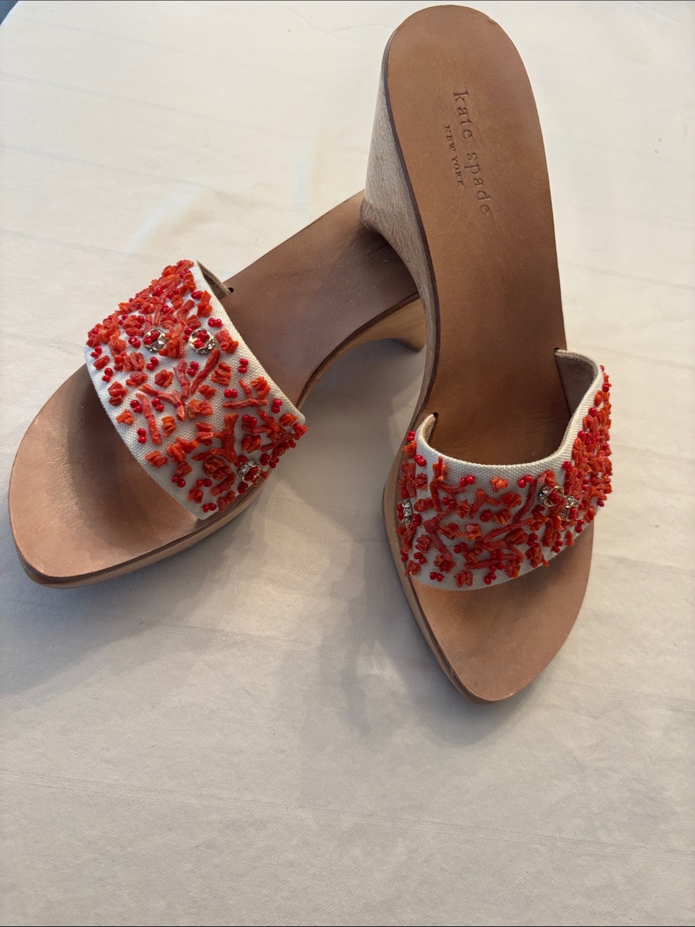 Kate Spade cream slides with coral beaded embroidery, wooden heels, size 7.5